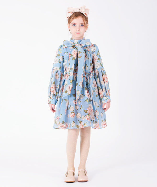 Floral Bow blue rose print girls dress with statement bow and below-the-knee silhouette front view
