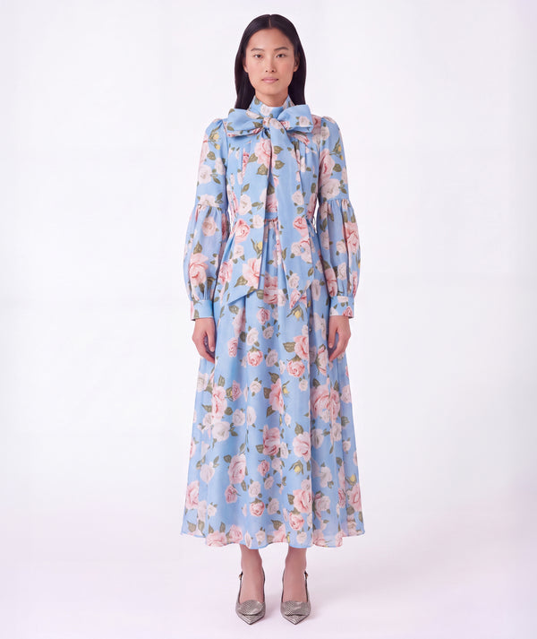 Floral Bow Women's Dress in blue with pink rose print, statement neckline bow and flowing skirt from Mama Luma