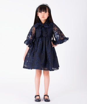 Front view of Floral Lace Cape Girls Dress in navy floral lace for girls ages 3 to 12, a premium children’s design by Mama Luma