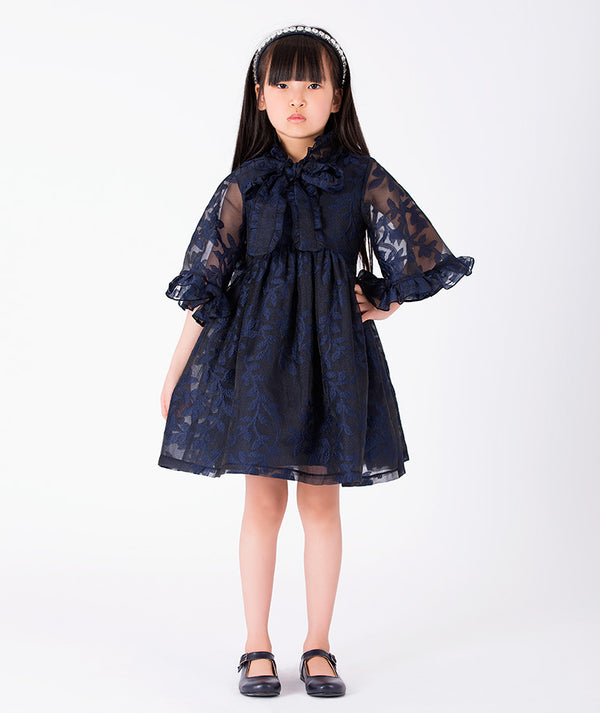Front view of Floral Lace Cape Girls Dress in navy floral lace for girls ages 3 to 12, a premium children’s design by Mama Luma