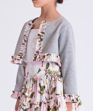 Close-up of ruffle trimmed bolero on floral skirt set for girls by Mama Luma, elegant girls occasion outfit detail