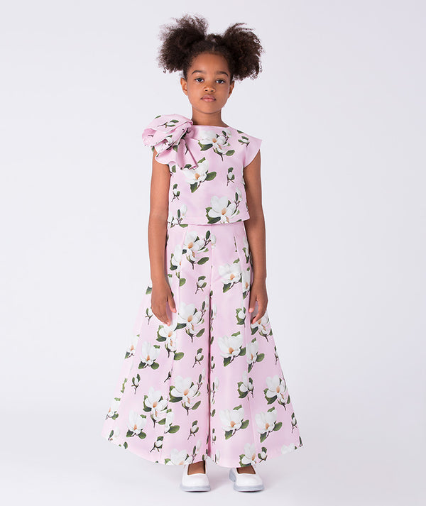 Pink floral ruffle girls outfit featuring a ruffled top and wide-leg pants, two-piece set by Mama Luma