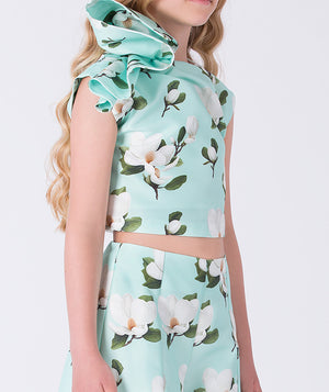 Floral ruffle girls outfit featuring a sleeveless ruffled top and wide-leg floral pants, two-piece set by Mama Luma