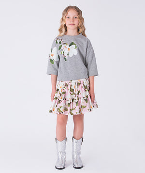Front view of floral ruffle girls skirt outfit by Mama Luma, elegant two-piece set with ruffle top and floral skirt for girls