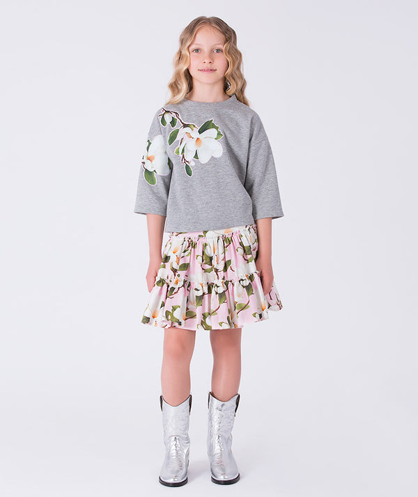 Front view of floral ruffle girls skirt outfit by Mama Luma, elegant two-piece set with ruffle top and floral skirt for girls