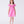 Load image into Gallery viewer, Luxury girls occasion dress in vibrant pink, worn by a 7-year-old girl, featuring sculptural ruffle shoulders, floral appliqués and a softly flared skirt for special events.
