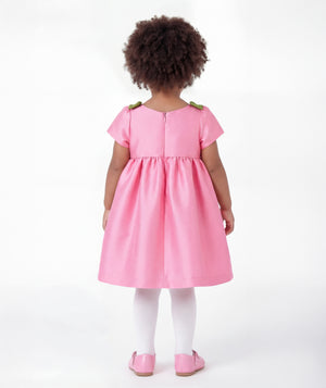 Back view of Floral Shoulder Detail Baby Dress in pink satin for babies 12 to 36 months, highlighting neckline, sleeves and embellishments