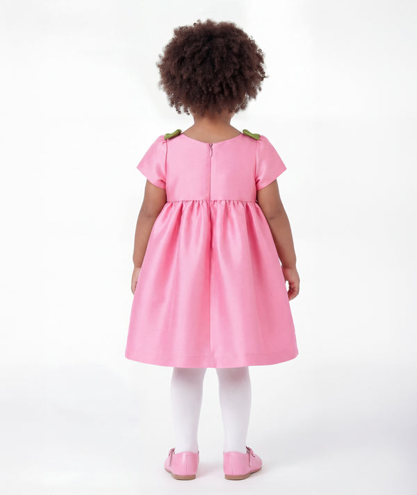 Back view of Floral Shoulder Detail Baby Dress in pink satin for babies 12 to 36 months, highlighting neckline, sleeves and embellishments