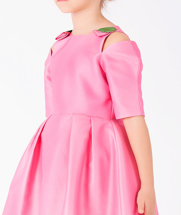 Close-up of Floral Shoulder Detail Girls Dress in vibrant pink structured matte satin for girls ages 3 to 12, highlighting fabric texture and color