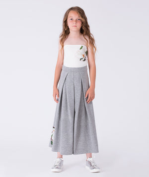 Front view of floral strapless wide-leg girls outfit by Mama Luma, elegant two-piece set with strapless top and flowing pants