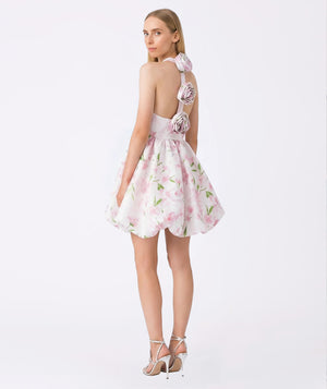 Woman wearing a floral dress with a white background