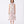 Charger l'image dans la galerie, Woman wearing a pink floral dress on a white background
