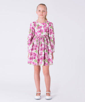 Flowy bougainvillea girls dress with floral print, long sleeves and softly flared skirt, designed for special occasions and celebrations