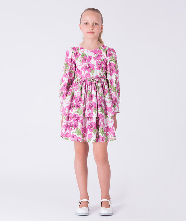 Flowy bougainvillea girls dress with floral print, long sleeves and softly flared skirt, designed for special occasions and celebrations