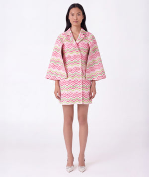 Front view of pink and green chevron girls cape outfit