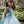 Load image into Gallery viewer, Girl in a mint floral fit-and-flare dress in a garden
