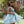 Load image into Gallery viewer, Girl twirling in a mint floral summer occasion dress
