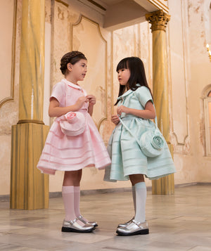 Girls carrying Mama Luma 3D Floral Bags in aqua and baby pink — satin floral handbag with rose appliqué, perfect for Easter, birthdays and festive occasions