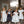 Charger l'image dans la galerie, Girls model elegant white and black midi dresses with bows, puff sleeves and music-note embroidery
