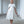 Load image into Gallery viewer, Girls elegant ivory dress with soft cape-style overlay and flowing midi skirt, designed for flower girl roles, weddings, christenings, and special formal occasions, available in sizes 3–12
