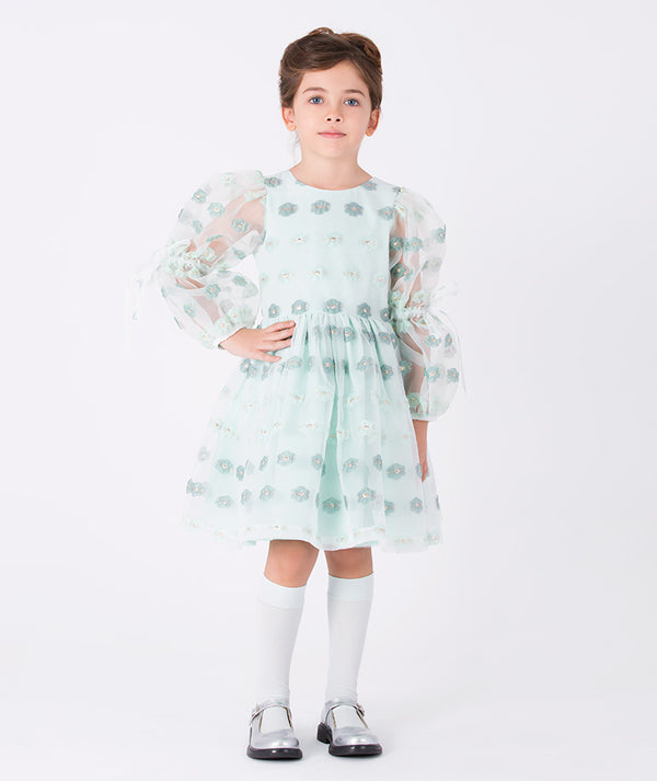Girl wearing Mama Luma Jacquard Flowers Girls Dress — mint jacquard with floral motifs and puff sleeves, perfect for Eid, weddings and birthdays