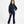 Charger l'image dans la galerie, Front-facing lifestyle image of a girl wearing a navy hoodie with coordinating flared pants, styled for polished school outfits, everyday confidence, and comfortable movement, available in sizes 3–14
