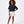 Load image into Gallery viewer, Girl wearing a navy short sleeve sweatshirt and white shorts, styled for everyday athleisure, school days, and active play, available in sizes 3–14
