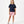 Load image into Gallery viewer, Girl wearing a navy short sleeve t-shirt and pink shorts, styled for everyday athleisure, school days, and active play, available in sizes 3–14
