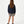 Load image into Gallery viewer, Girl seen from the back wearing a navy sweatshirt and taupe shorts, styled for everyday athleisure, school days, and active play, available in sizes 3–14
