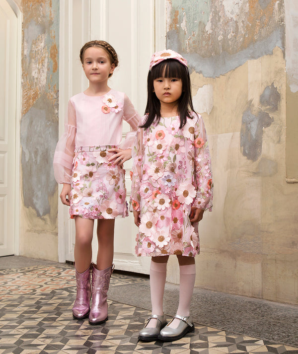 Girls wearing Mama Luma silver Mary Jane shoes with occasion dresses — luxury patent leather footwear for birthdays, Easter and family gatherings