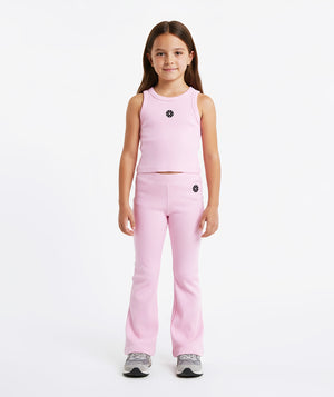 Girl wearing a pink sleeveless tank top and matching ribbed pants, styled for everyday athleisure, school days, and active play, available in sizes 3–14