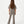 Charger l'image dans la galerie, Girl seen from the back wearing a taupe short sleeve t-shirt and matching ribbed pants, styled for everyday athleisure, school days, and active play, available in sizes 3–14
