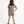 Load image into Gallery viewer, Girl seen from the back wearing a taupe short sleeve t-shirt and matching taupe shorts, styled for everyday athleisure, school days, and active play, available in sizes 3–14
