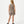 Carica l'immagine nel visualizzatore Galleria, Back-facing lifestyle image of a girl wearing a taupe sleeveless tank top with matching shorts, styled for warm-weather play, casual movement, and everyday comfort, available in sizes 3–14
