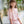 Load image into Gallery viewer, Girl in Mama Luma pastel pink lace outfit with floral embroidery and flared sleeves, styled with a flower crown — luxury girls’ wedding and flower girl dress

