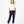 Charger l'image dans la galerie, Front-facing lifestyle image of a girl wearing a white short sleeve t-shirt with navy jogger pants, styled for comfortable school outfits, relaxed movement, and daily wear, available in sizes 3–14
