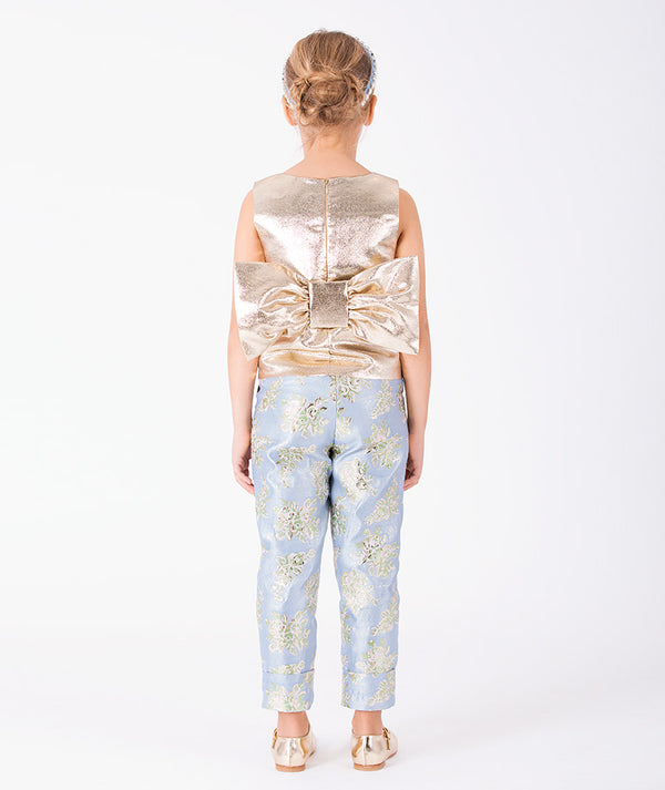Gold Flowers girls two-piece outfit with oversized metallic bow and blue floral jacquard trousers back view