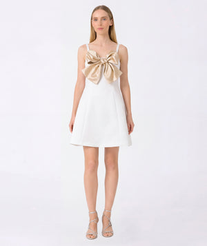 blonde women wearing asari dress gold bow and white dress bridal