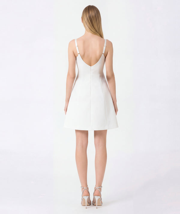 blonde women wearing white dress back shot
