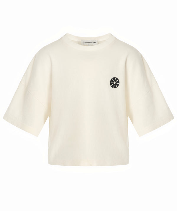 Cream cropped unisex kids activewear t-shirt with short sleeves and a black sunburst logo, GoldenCubs athleisure essential available in sizes 3–14Y, perfect for school, playtime, and everyday comfort.