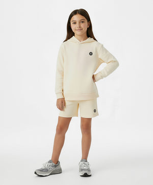 Girl wearing a cream GoldenCubs hoodie and matching active shorts, a cozy everyday athleisure set perfect for school, playdates, sports practice, and weekend outings, available in sizes 3–14.