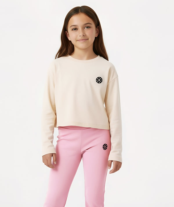 GoldenCubs beige cropped sweatshirt paired with pink flare pants, designed for girls who love comfort and modern sporty style. Perfect for school, lounging, and weekend adventures. Available in sizes 3–12Y.