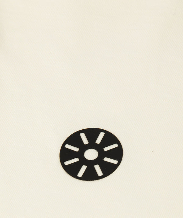 GoldenCubs kids activewear black circular logo printed on soft cream fabric, showcasing the brand’s signature minimalist emblem for premium children’s clothing