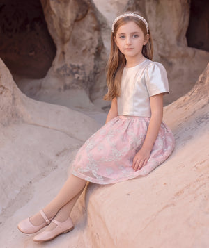 Editorial view of the Hanae silver and blush pink jacquard bow girls’ outfit for ages 3 to 12