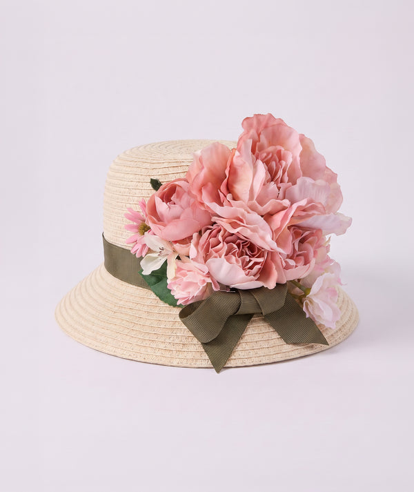 Handcrafted Beige Straw Sun Hat with Blush Peonies featuring a classic bucket silhouette with handcrafted flowers, designed as a stylish girls’ accessory for summer holidays, beach days, outdoor outings, and special occa