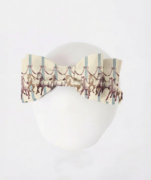 Girls horse print bow headband with blue stripes and equestrian artwork from Mama Luma’s Altai Morin Collection.