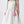 Load image into Gallery viewer, Elegant ivory girls dress featuring soft green shoulder straps with 3D pink tulip accents and a voluminous skirt. A refined special occasion piece designed with delicate structure and timeless charm.
