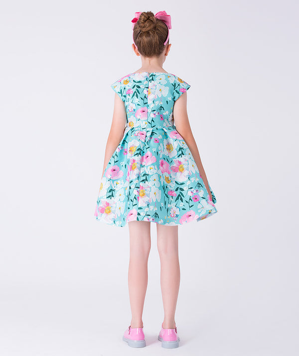 Back view of Kohana Petals Girls Dress showing flared silhouette, floral print, and elegant knee-length design for girls.