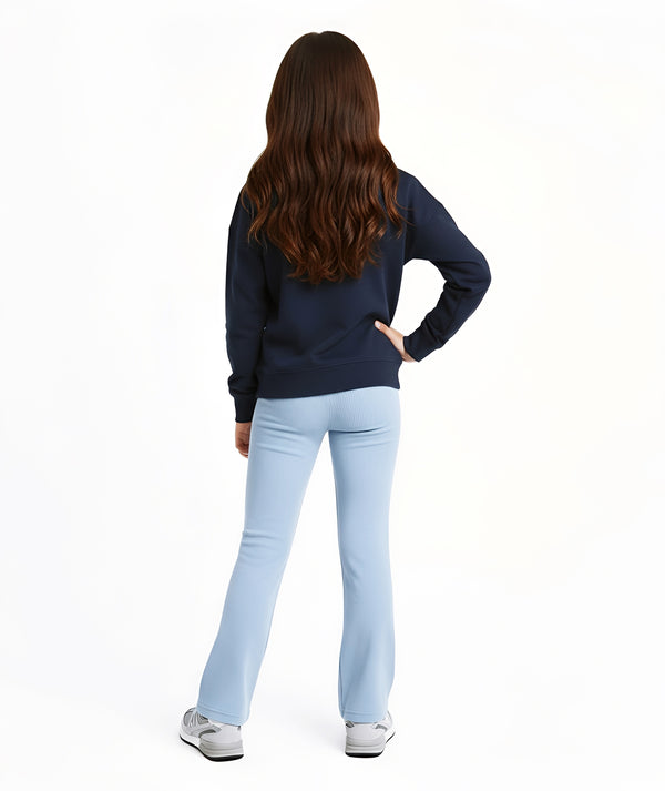 Girl seen from the back wearing a navy sweatshirt and light blue pants, styled for everyday athleisure, school days, and active play, available in sizes 3–14