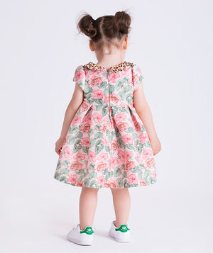 Back view of the Mahe Lotus Floral Baby Dress showing the softly flared silhouette and back zip closure, made from breathable lightweight fabric, designed for babies ages 12–36 months for family gatherings, holidays, and warm-weather outings.